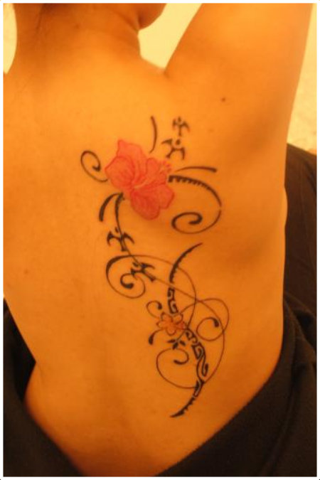 Beautiful Polynesian feminine back tattoo