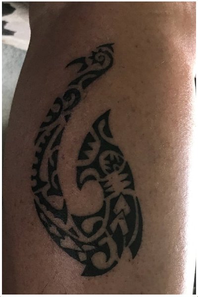 Calf Polynesian fish hook tattoo